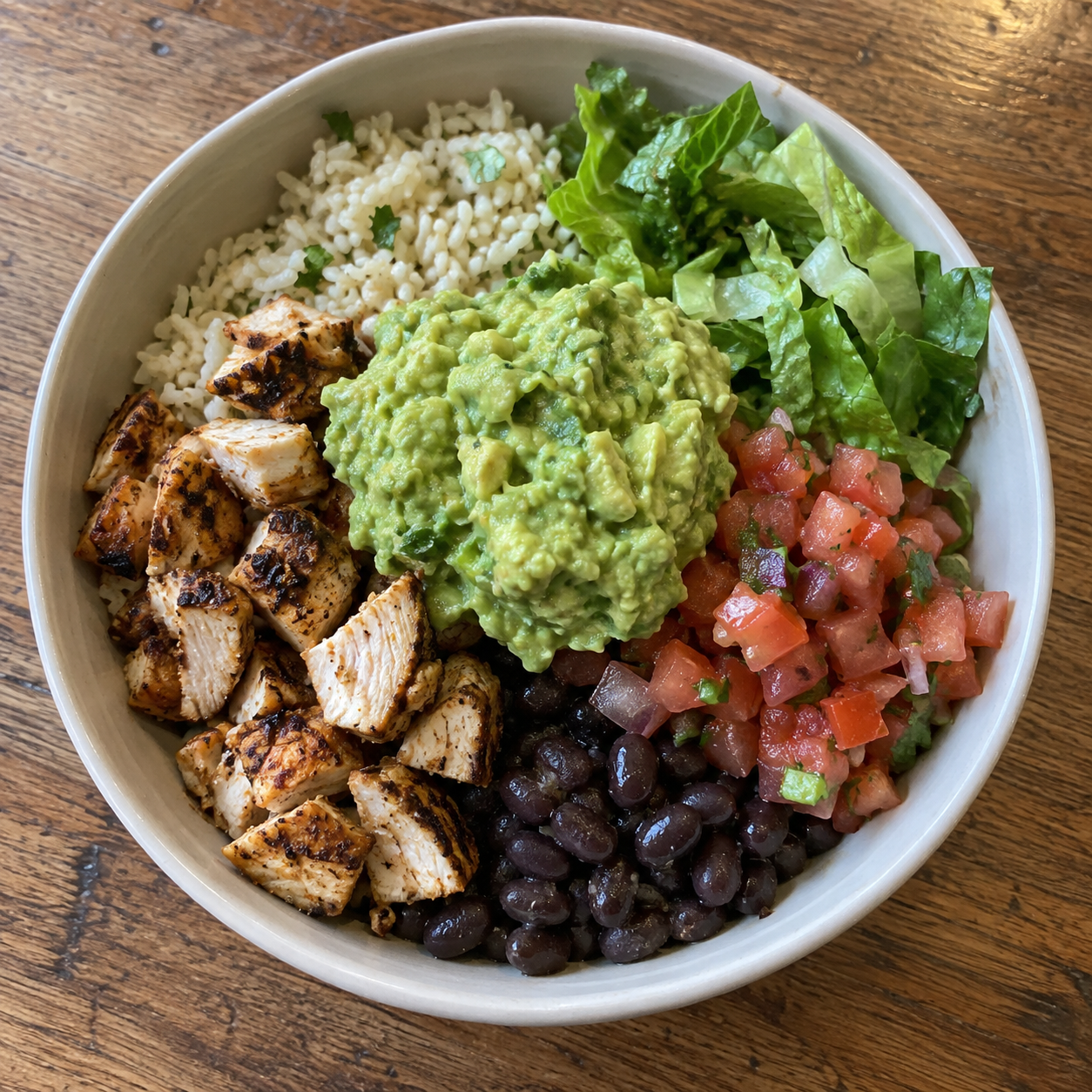 User-sent lunch photo: chicken burrito bowl with guacamole